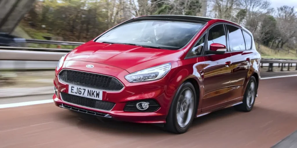 Red Ford S-MAX driving on a highway.